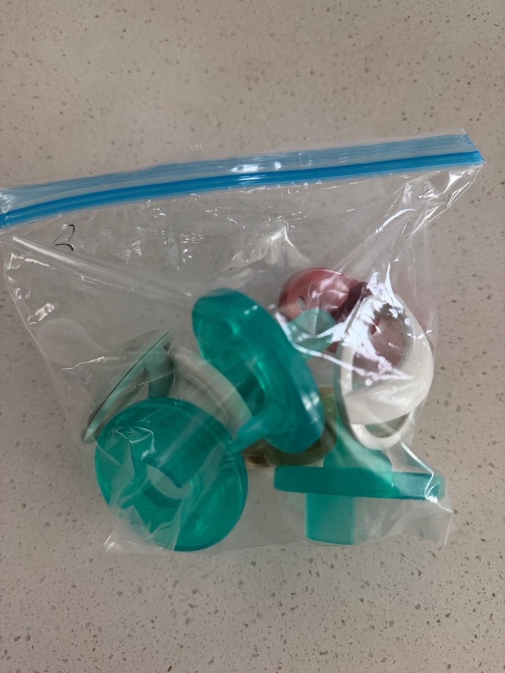 Assorted Teal and White Pacifier